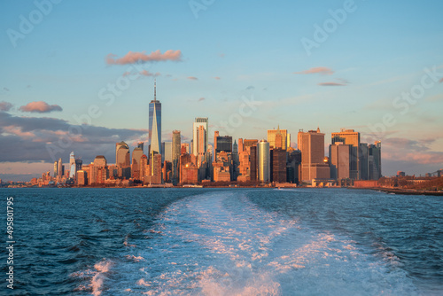 New York City skyline at sunset from New York Harbor featuring the Financial District
