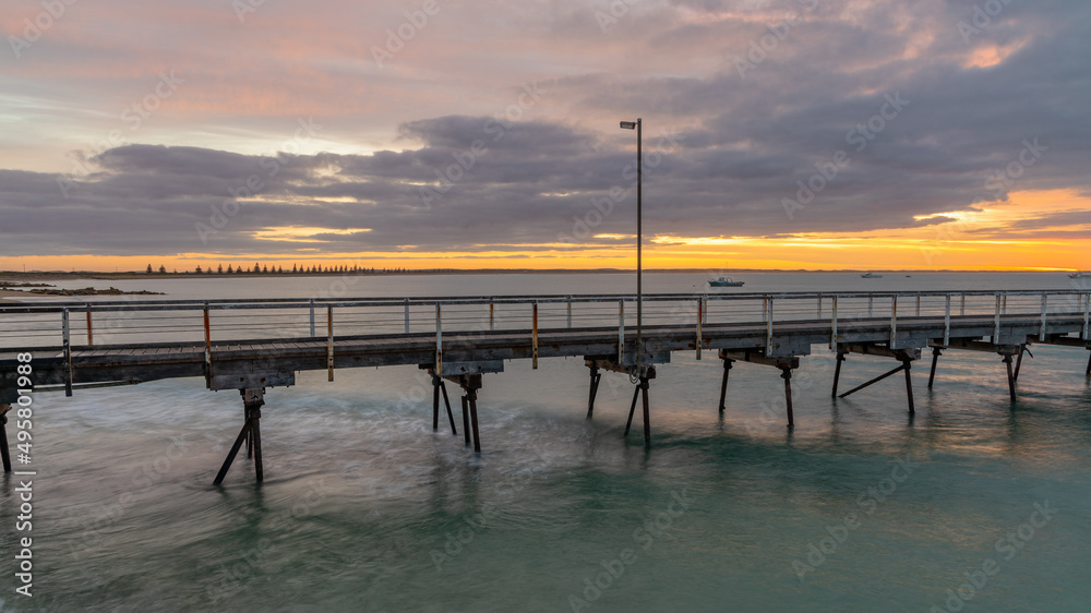 Obraz premium Sunrise over the Beachport Jetty located in the southeast of South Australia taken on February 20th 2022