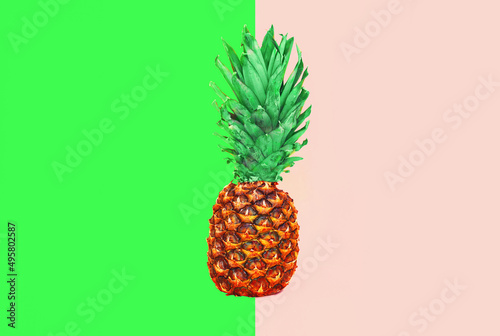 Pineapple fruit on colorful pink green background