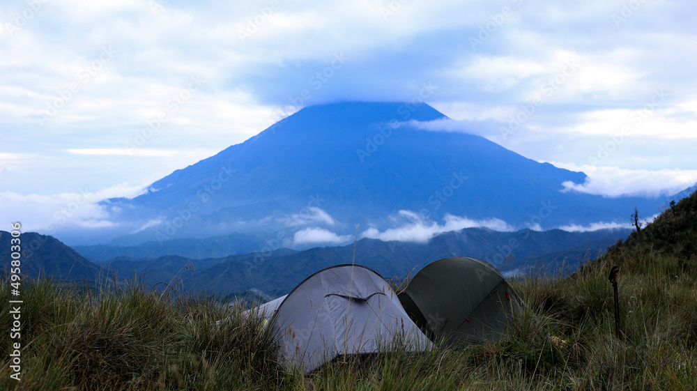 Two tents set up in front of the Sangay volcano in Ecuador