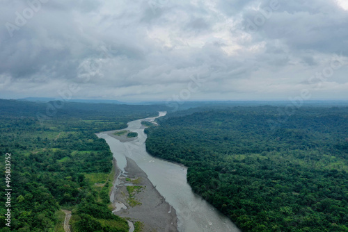 Large river in the Amazon surrounded by secondary forest and patches of agriculture