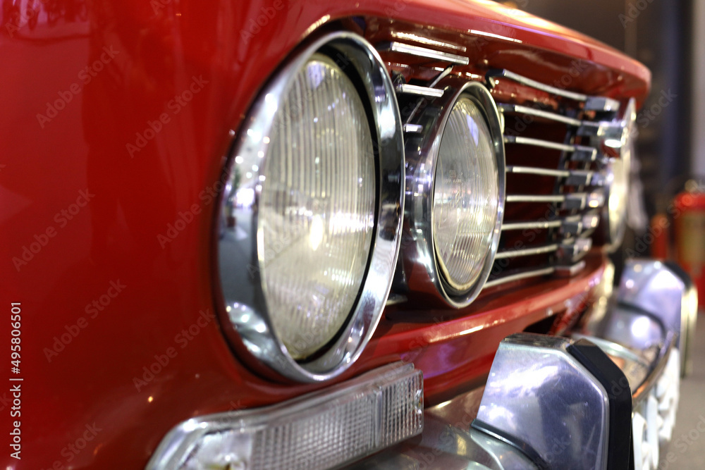 Front Side Head Lights An Bumper Of A Red Colored antique car