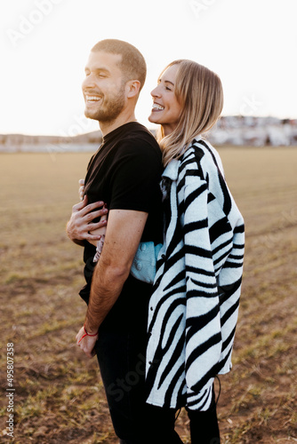 Couple kissing in the countryside embraced. Boyfriend and girlfriend in love