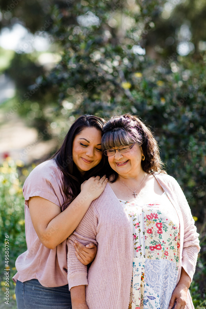 Mother & Daughter Embracing at Park in San Diego Mother & Daughter Embracing at Park in San Diego