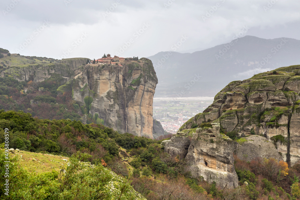 Orthodox monasteries of Meteora (Greece) on the rocks shrouded in fog