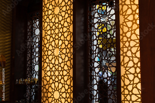 Oriental interior home design with mosaic and mashrabiya ornaments photo