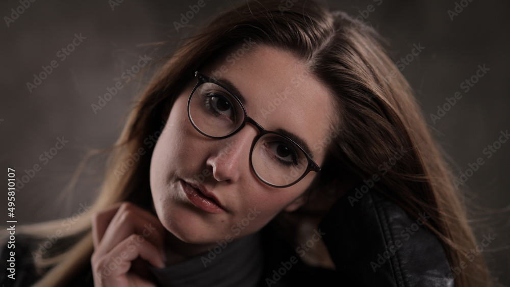 Close-up shot of a young attractive woman in her mid 20s - studio photography