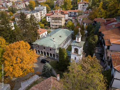 Beautiful view of the Rila monastery and houses in Blagoevgrad, Bulgaria on an autumn sunny day photo