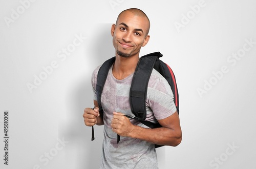 Advertising concept. High school student in wearing in t-shirt with backpack. photo