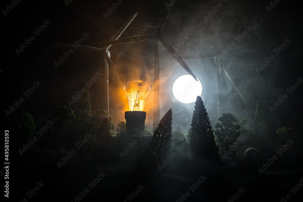 concept idea eco power energy. wind turbine on hill with sunset. Wind Turbine producing alternative energy. concept idea eco power energy. wind turbine on hill with sunset. Wind Turbine producing alternative energy.