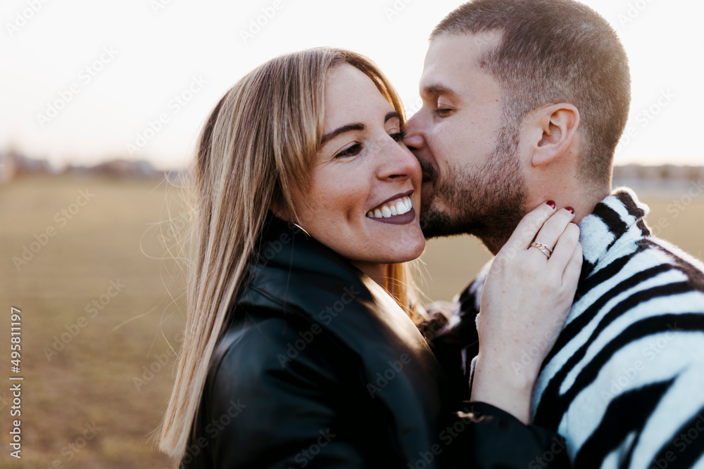 Close up couple nose kissing in the countryside embraced. Boyfriend and girlfriend in love Close up couple nose kissing in the countryside embraced. Boyfriend and girlfriend in love