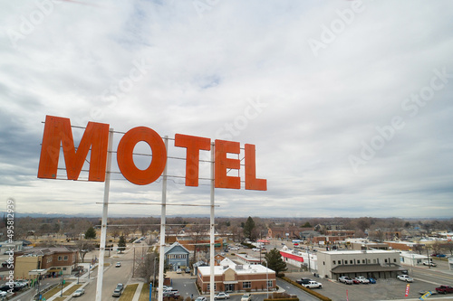 aerial view of a motel sign above a city
