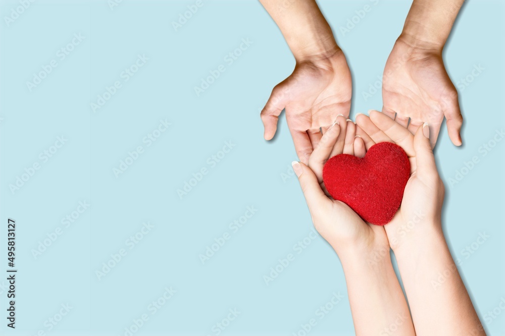 Concept Happy Mother's Day or International Day of Families. Heart in the hands of daughter and mother Concept Happy Mother's Day or International Day of Families. Heart in the hands of daughter and mother