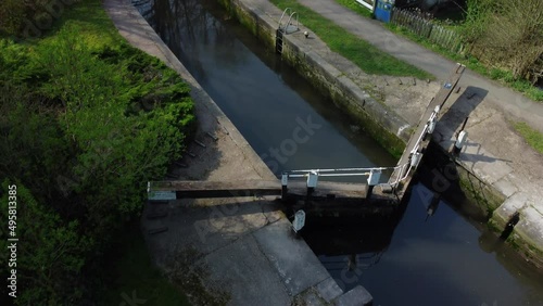 Aerial shot of Lock Keeper's Cottage and lock open Grand Union Canal, UK photo