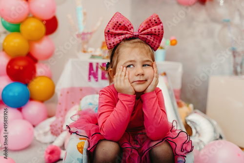  Girl with her birthday cake, happy birthday card,a cute little girl celebrates birthday surrounded by gifts