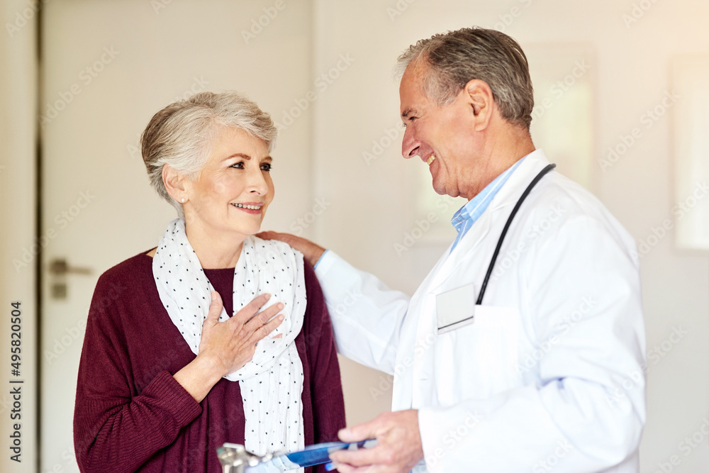 What a relief. Shot of a doctor having a conversation with his patient in the clinic. What a relief. Shot of a doctor having a conversation with his patient in the clinic.
