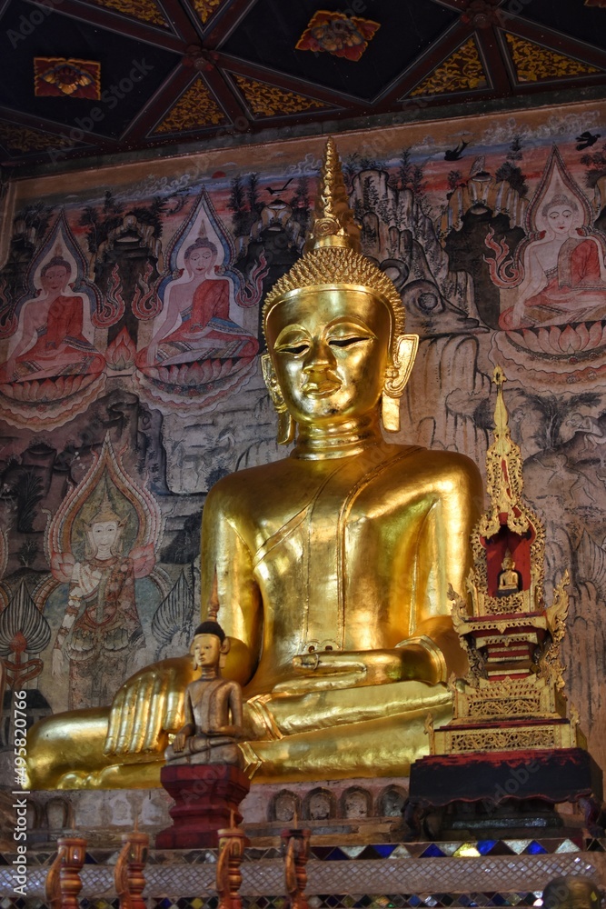 Golden Buddha image inside the main chapel of Nong Bua temple in Nan province, THAILAND.