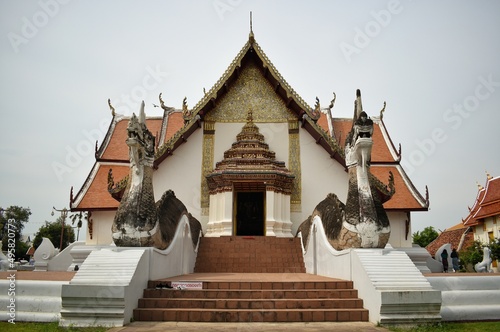 A frontal view of Wat Phumin, Nothern traditional Buddhist temple in Nan province, THAILAND. (The letter on the stairs means Please take off your shoes) photo