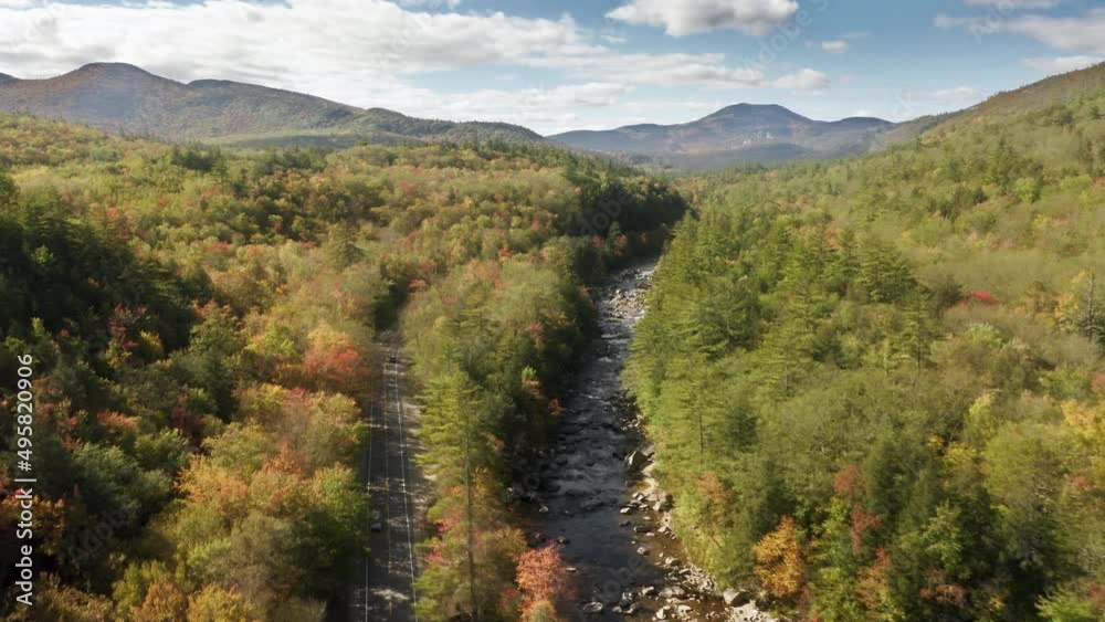 Aerial view of the fall natural landscape with white clouds behind Aerial view of the fall natural landscape with white clouds behind