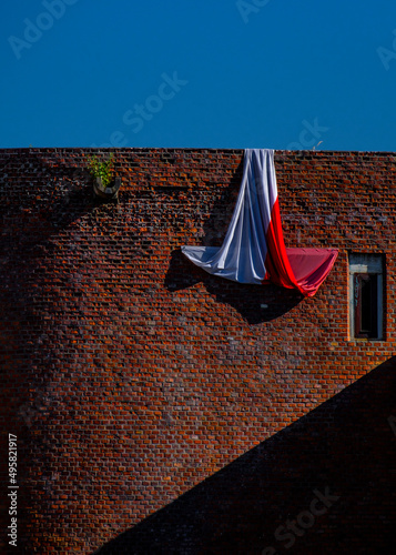 Canvas Print Folded flag on the Bratislava city walls