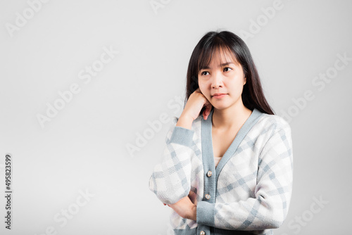 Happy woman hand touch chin handle relaxed thinking about something about the question, Portrait Asian beautiful young female idea think studio shot isolated on white background with copy space