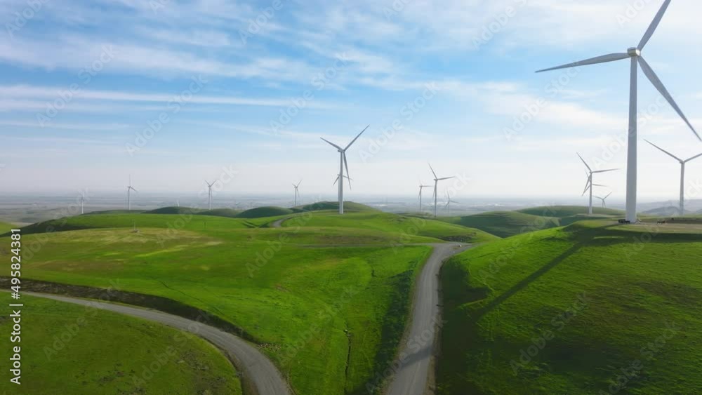 Windmill park green energy from drone view, windmill wind farm on green hills 4K