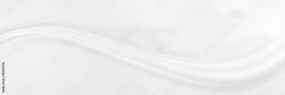 White gray satin texture that is white silver fabric silk panorama background with beautiful soft blur pattern natural.