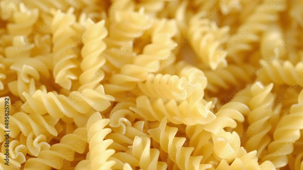 Pasta conchiglie.Pasta for food, rotation. Macaroni - Mini Conchiglie Rigate close up.Shell pasta Pasta conchiglie.Pasta for food, rotation. Macaroni - Mini Conchiglie Rigate close up.Shell pasta