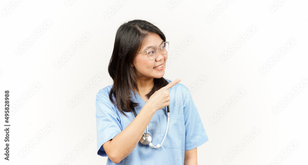 Showing Product and Pointing Side Of Asian Young Doctor Isolated On White Background Showing Product and Pointing Side Of Asian Young Doctor Isolated On White Background