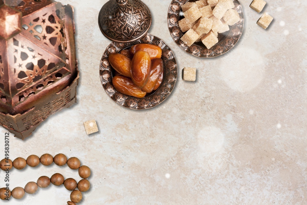 Ramadan Kareem and iftar Muslim holiday concept. Dried dates and lanterns with candles. Ramadan Kareem and iftar Muslim holiday concept. Dried dates and lanterns with candles.