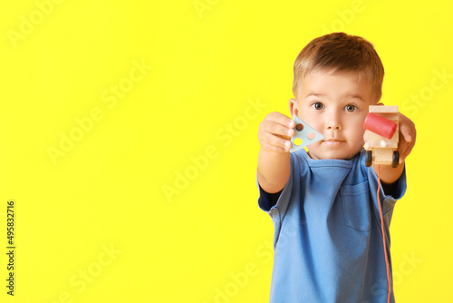 Cute little boy with wooden...