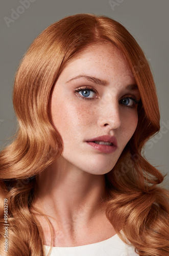 Striking beauty. Portrait of a gorgeous young woman with red hair.
