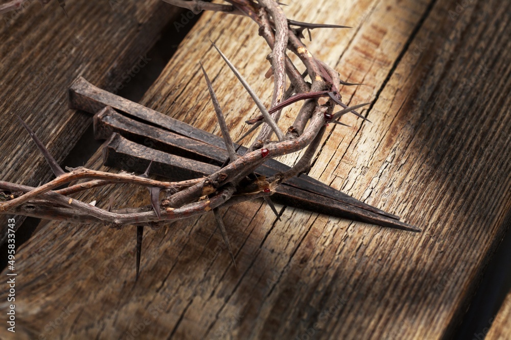 Christian crown of thorns with metal nails on a wooden desk Christian crown of thorns with metal nails on a wooden desk