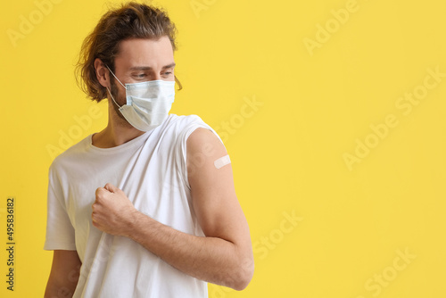 Young man in medical mask a...