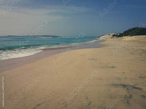 Exotic beach view in Africa. Romantic seascape  sandy surface  turquoise Atlantic Ocean water and vacation mood. Selective focus on the details  blurred background.