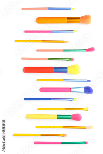 Set of colorful makeup brushes isolated on white, top view