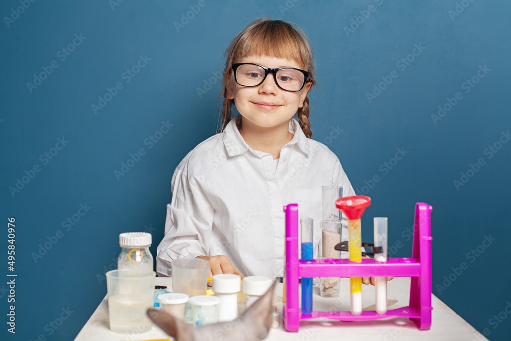 Smart girl with science lab experiment. Science and education concept Smart girl with science lab experiment. Science and education concept