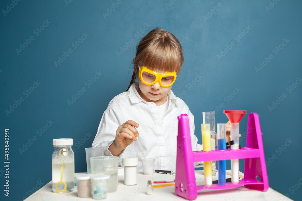 Portrait of kid girl student scientists making experiment in lab Portrait of kid girl student scientists making experiment in lab