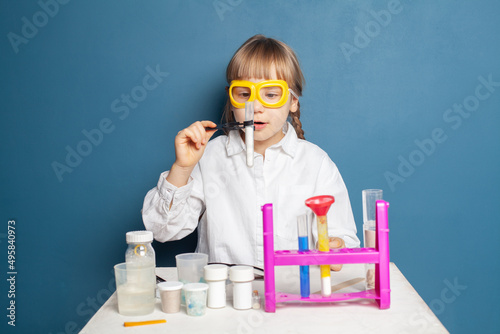 Clever child girl with science experiment