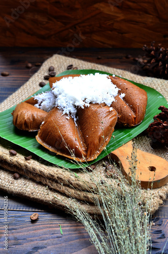 apang bugis or apem cake or food made from rice flour and palm sugar and coconut, traditional food from south sulawesi indonesia, selective focus photo