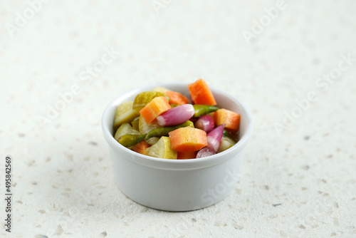 Acar, Side Dish for Chicken, Meat, or Martabak Dish. Diced Carrot and Cucumber with Green Chilli and Shallot, Mix with Vinegar, Sugar, Salt. photo