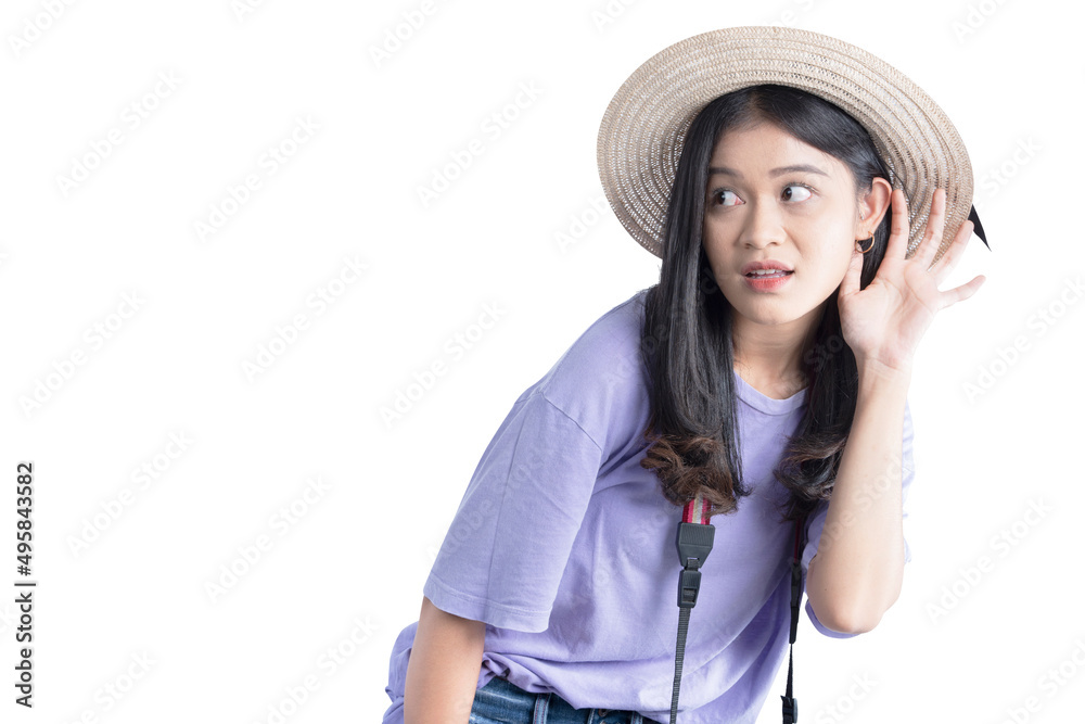 Asian woman with hat and camera hearing something Asian woman with hat and camera hearing something