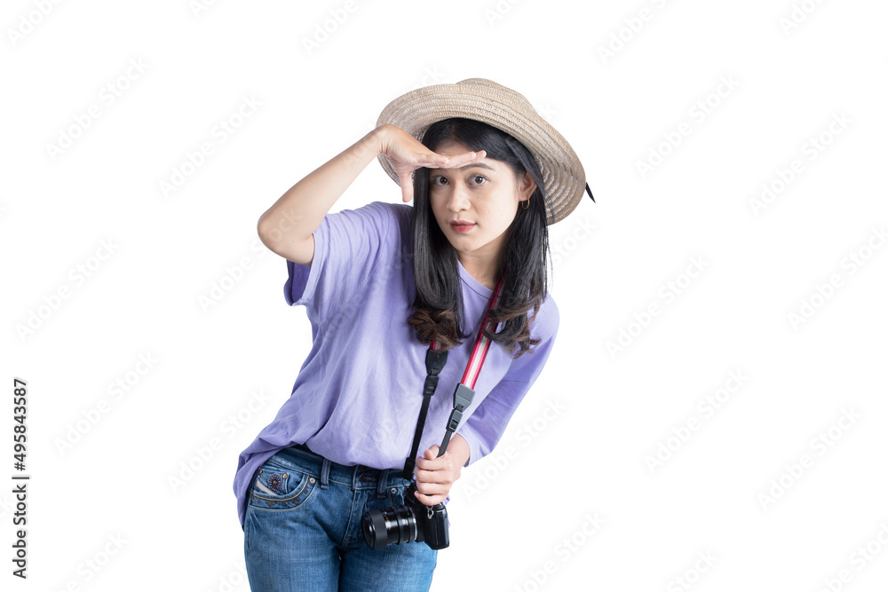Asian woman with hat and camera looking at something Asian woman with hat and camera looking at something
