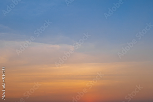 Beautiful orange sunset sky background. Evening sky a bright golden. © banphote