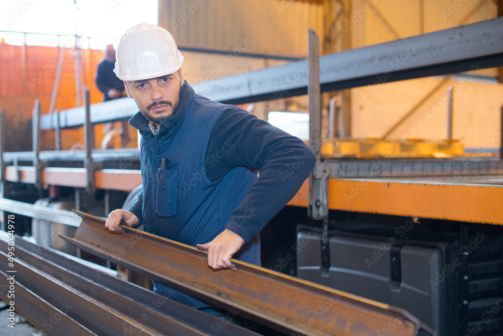 man lifting rsj in factory man lifting rsj in factory