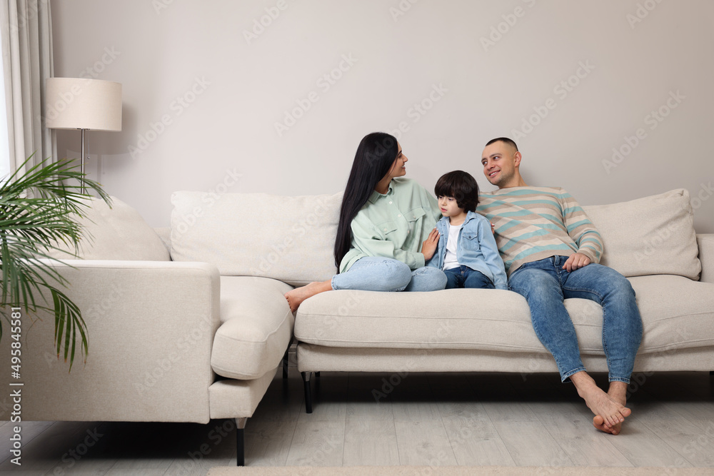 Happy family spending time together on sofa at home Happy family spending time together on sofa at home