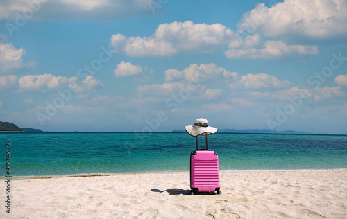 The Banner of explore vacation in Summer tropical concept with Pink luggage on the white sand Beach background © SASITHORN