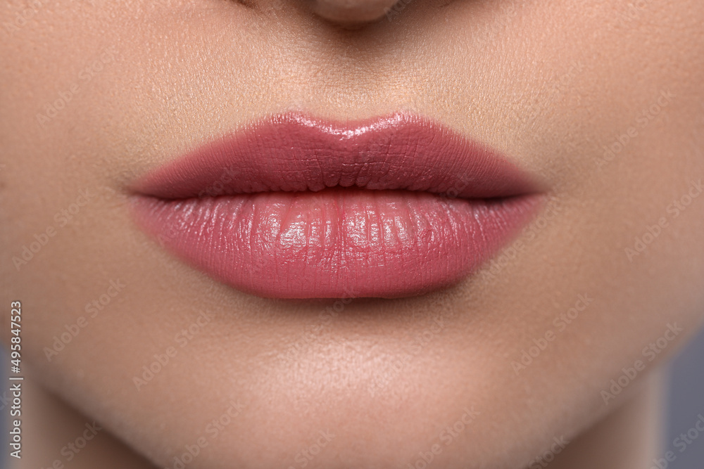 Young woman with beautiful plump lips, closeup Young woman with beautiful plump lips, closeup