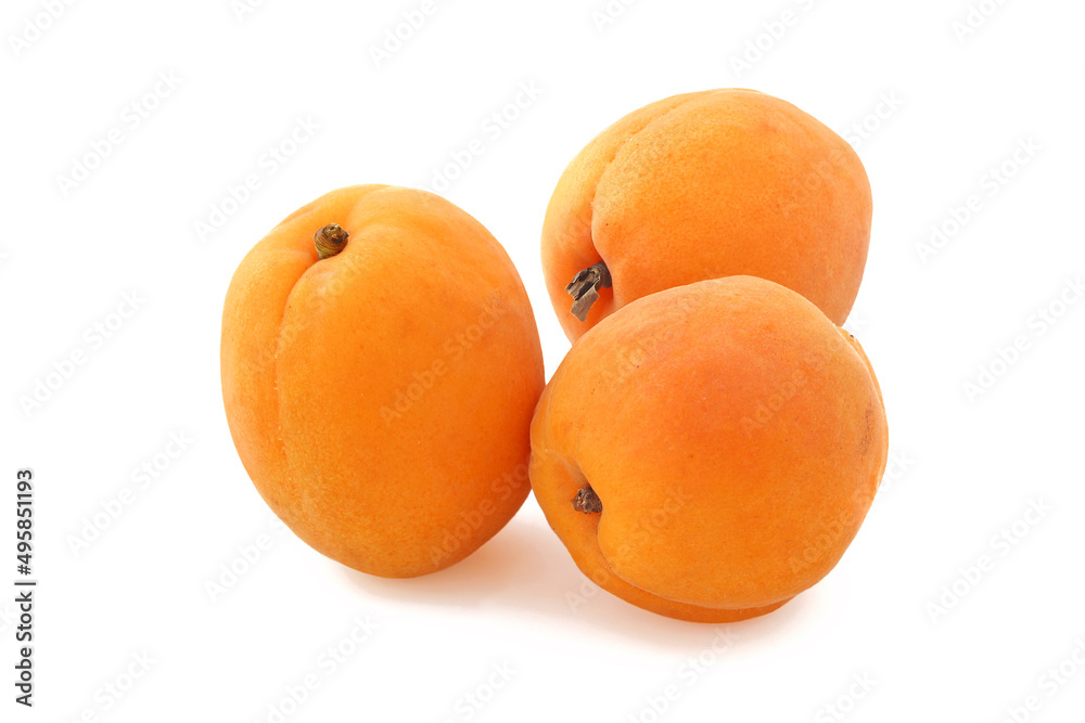 Three big flat ripe apricots isolated on white background Three big flat ripe apricots isolated on white background