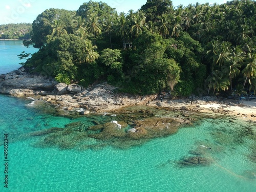 At Sea Island.Aerial view. Top view.amazing nature background.The color of the water and beautifully bright.Azure beach with rocky mountains and clear water of Thailand ocean at sunny day